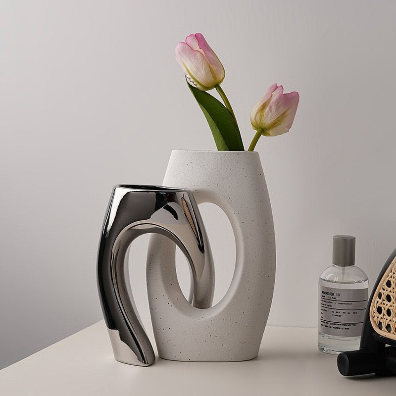 Linked modern silver white vases